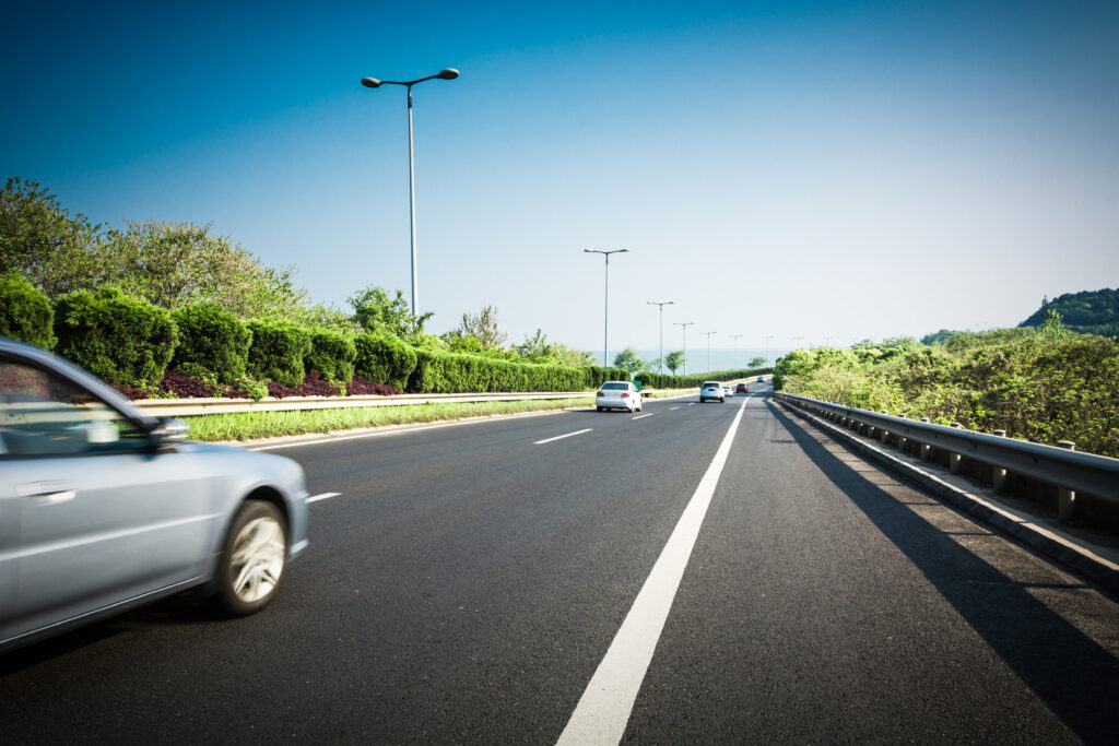 Car On Asphalt Road In Summer