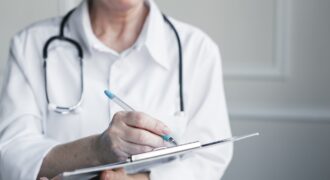 Doctor With Medical Report