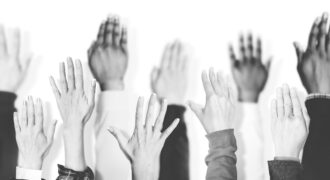 Multiethnic Group Of Hands Raised