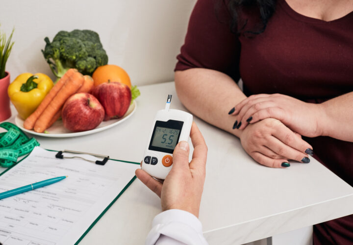 Measuring,blood,sugar.,nutritionist,using,glucometer,tests,overweight,woman's,blood